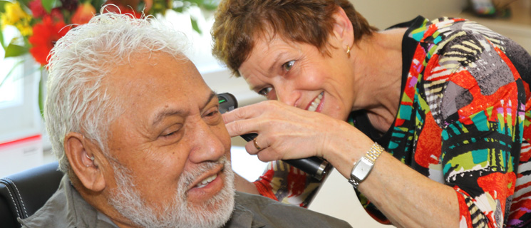 Heidi Examining the Ear Canal of a Client Using an Otoscope